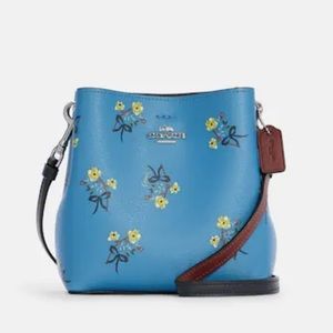 NWT Mini Town Bucket Bag With Floral Bow Print
Coach Blue